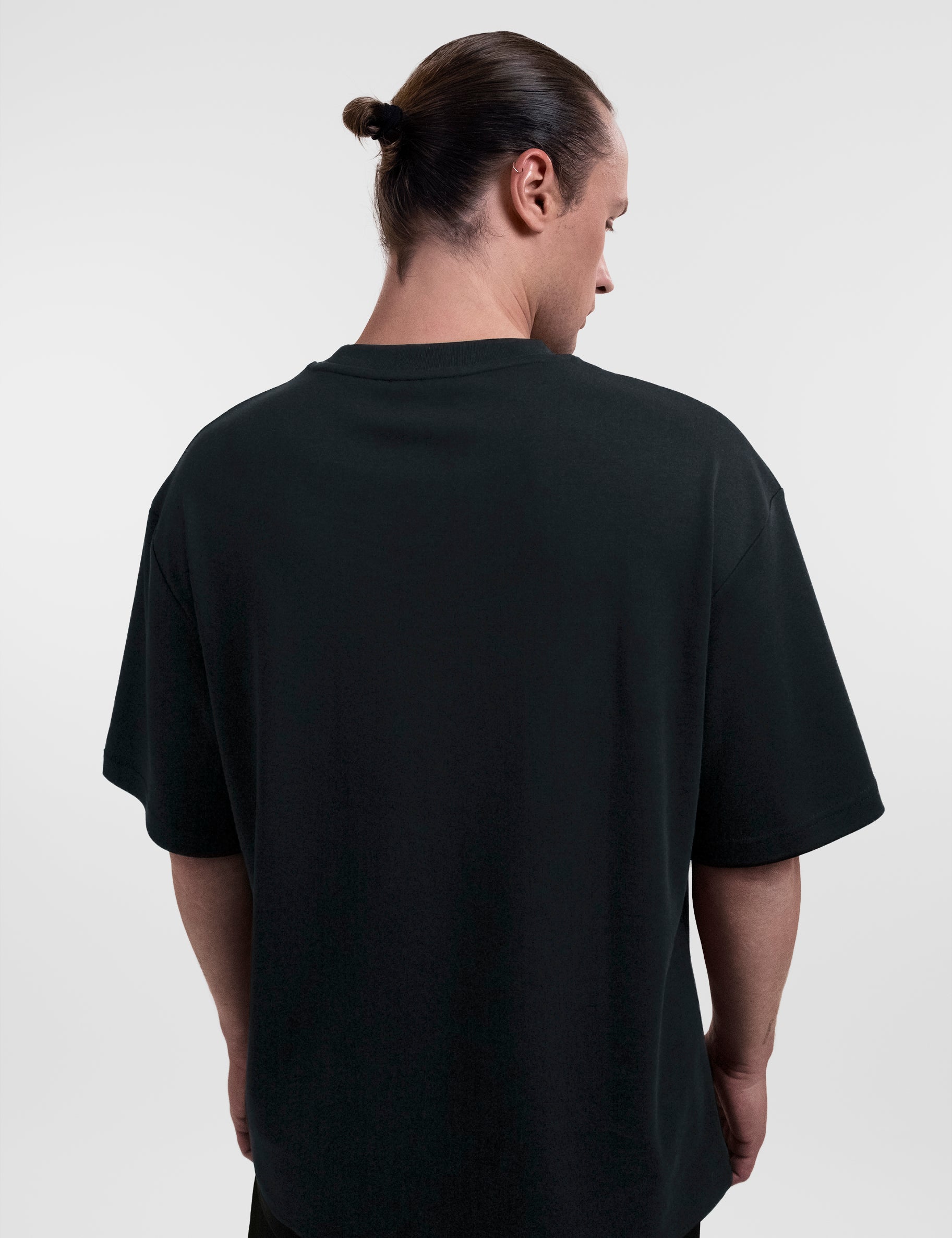 Open Row Men's Open Heart Tee in black, back view.
