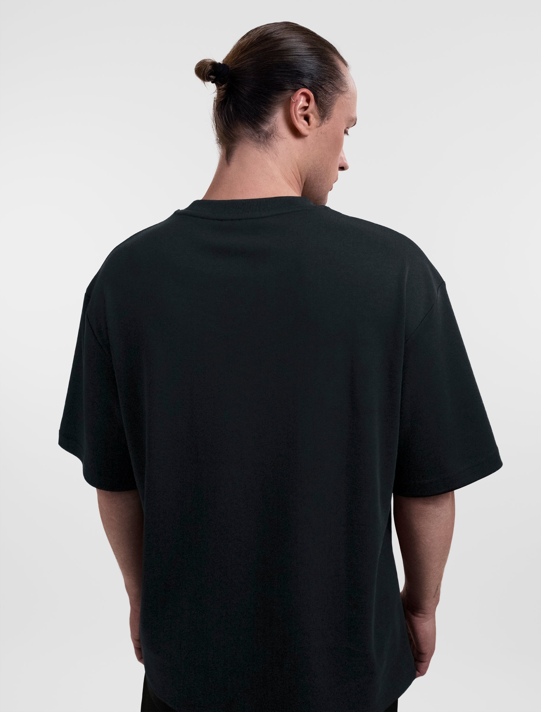 Open Row Men's Open Heart Tee in black, back view.