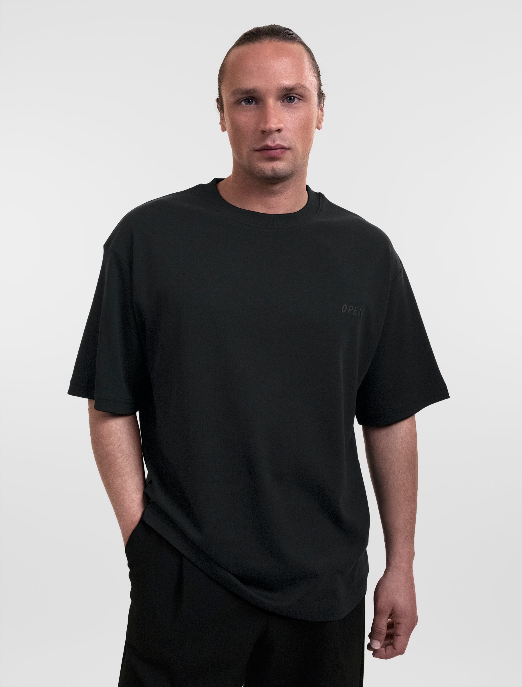 Open Row Men's Open Heart Tee in black, front view.