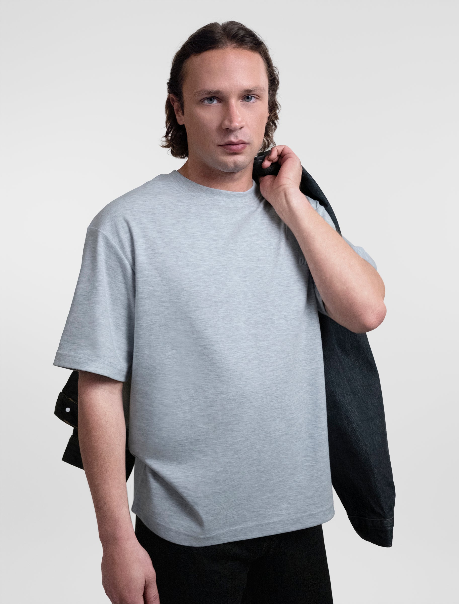 Open Row Men's Open Heart Tee in grey, front editorial view paired with a denim jacket.