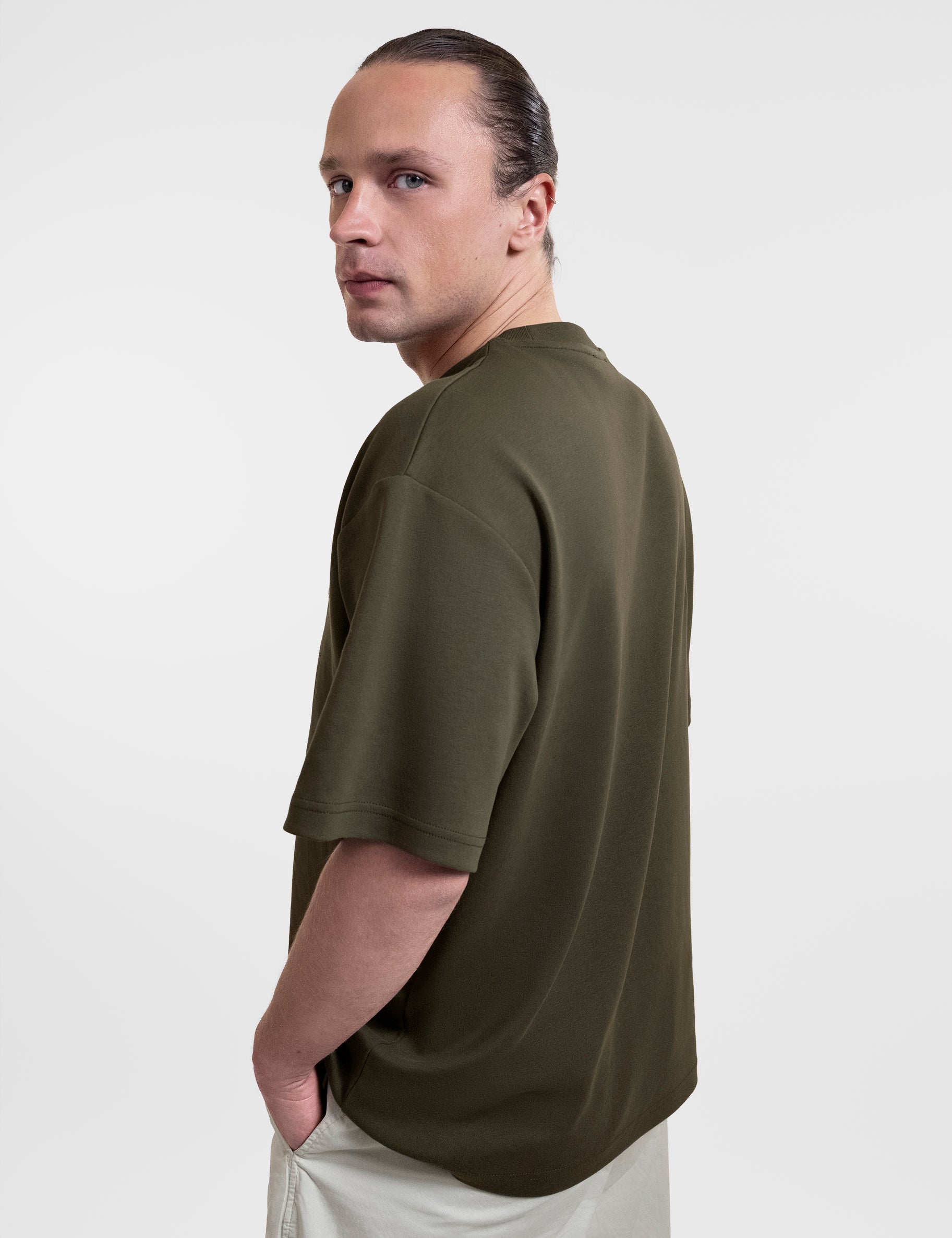 Open Row Men's Open Heart Tee in khaki green, side view.