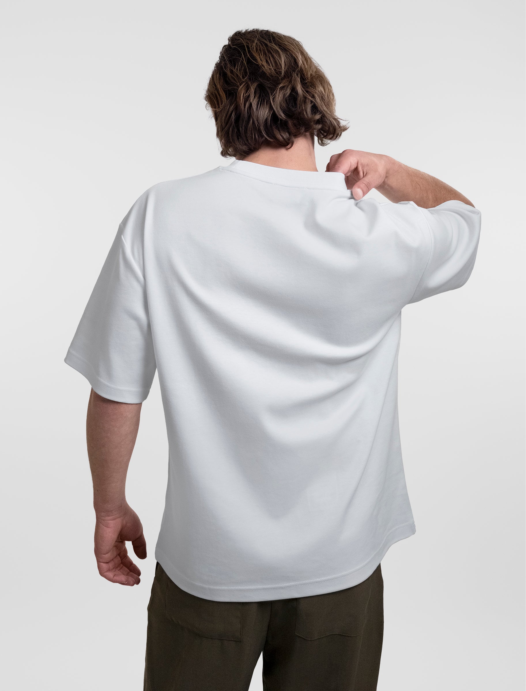 Open Row Men's Open Heart Tee in white, back view.