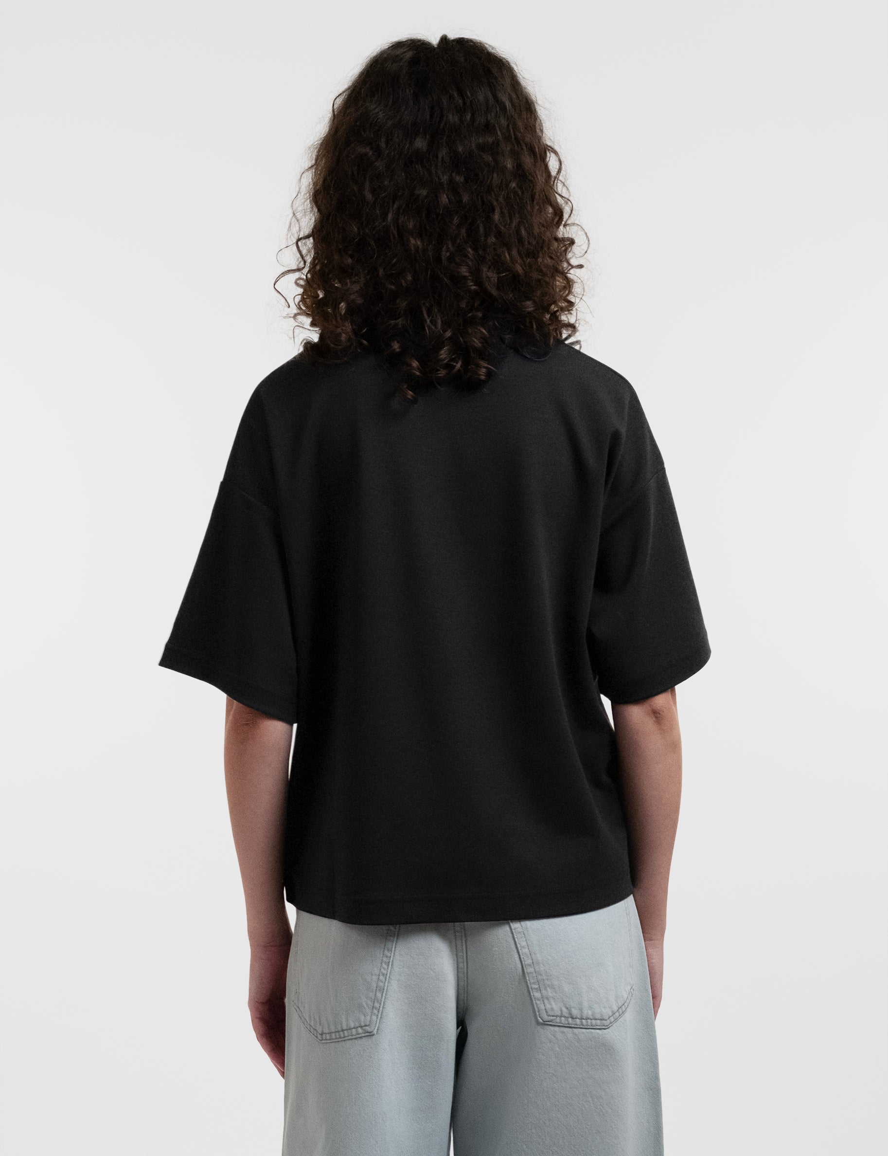 Open Row Women's Open Heart Tee in black, back view.