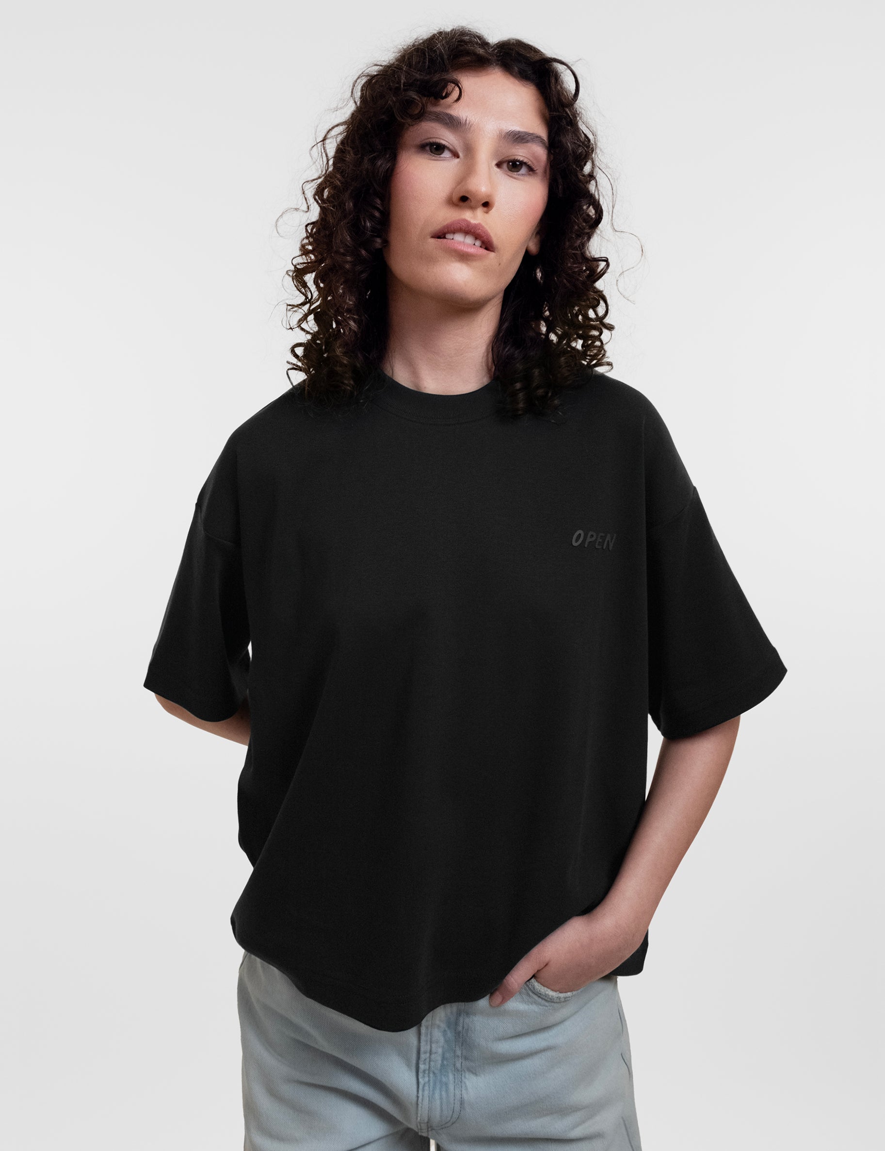 Open Row Women's Open Heart Tee in black, front editorial view.