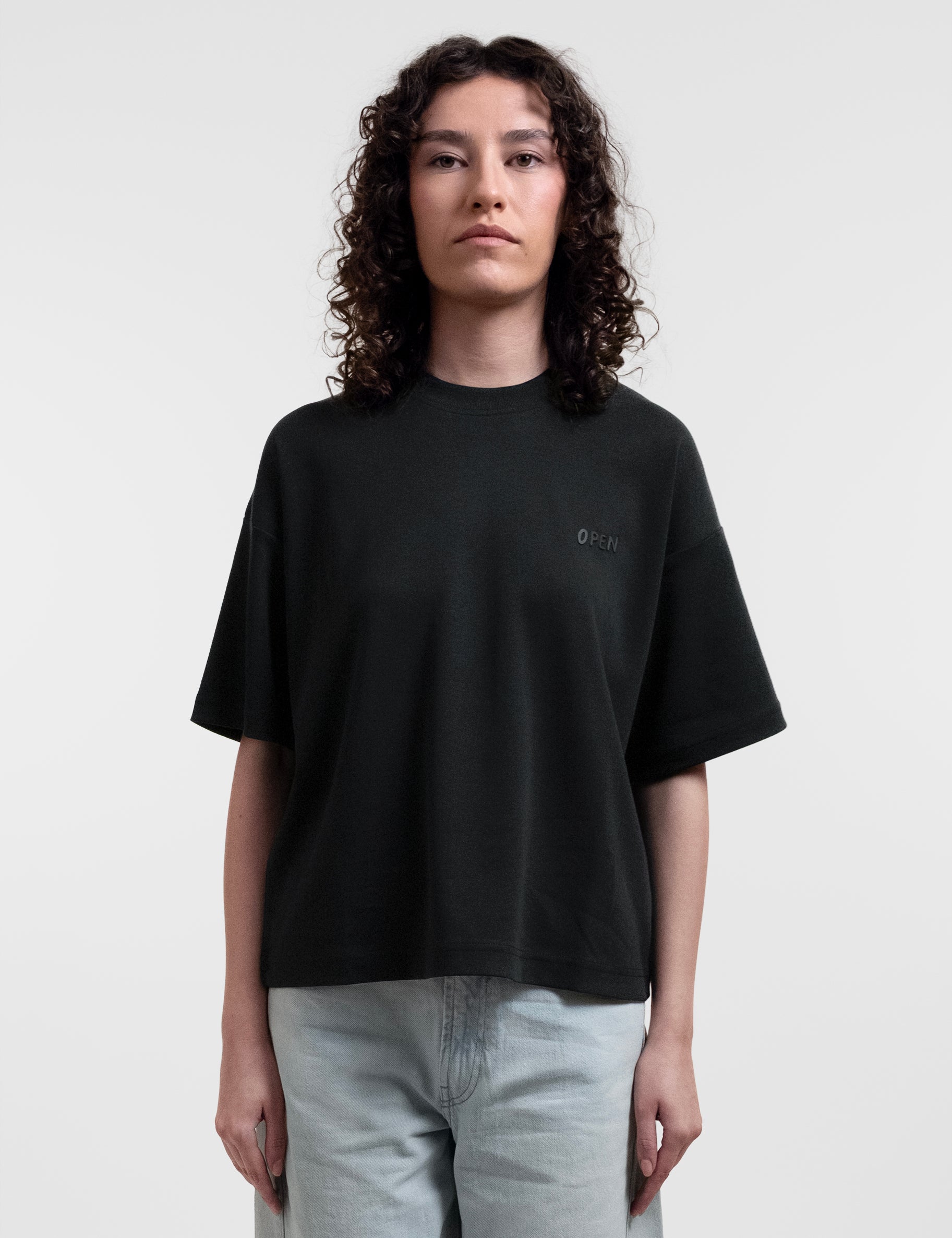 Open Row Women's Open Heart Tee in black, front view.