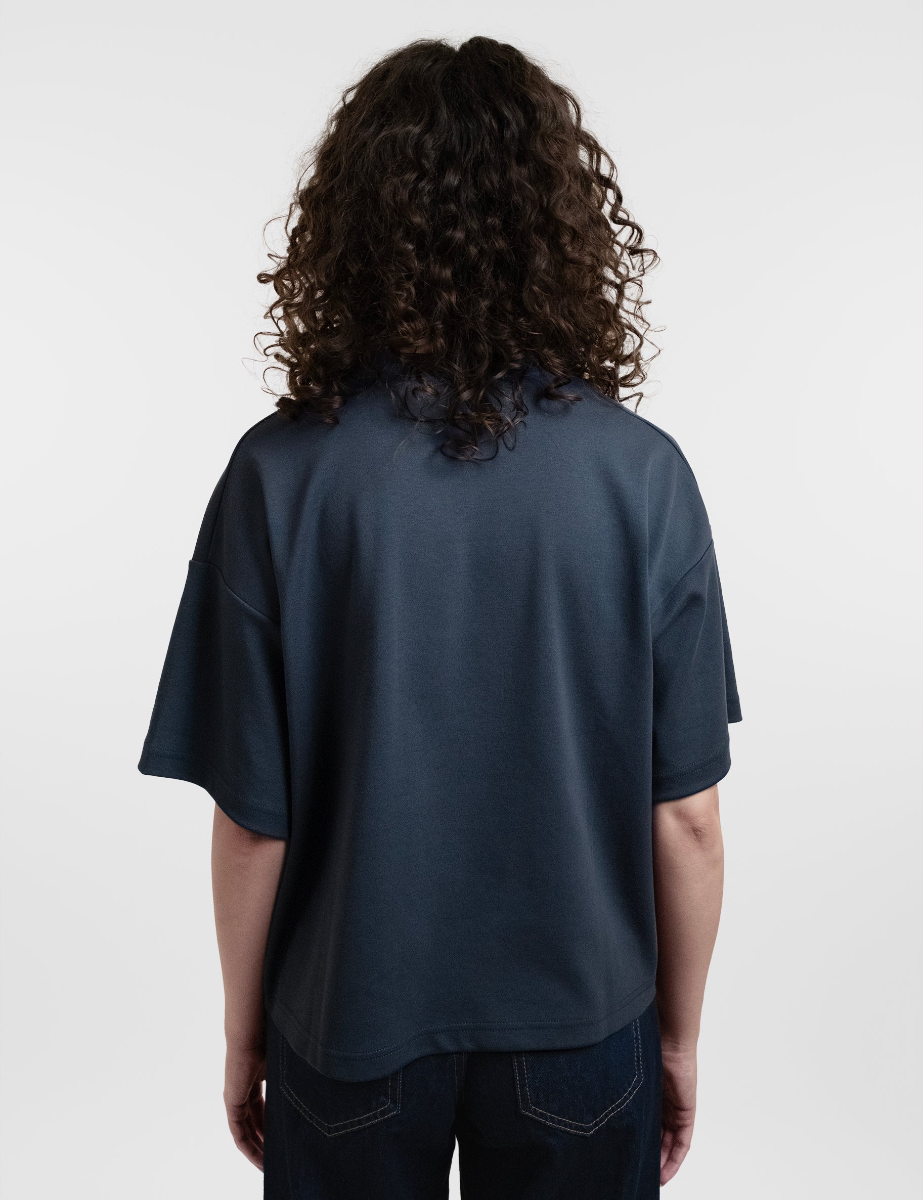 Open Row Women's Open Heart Tee in navy blue, back view.