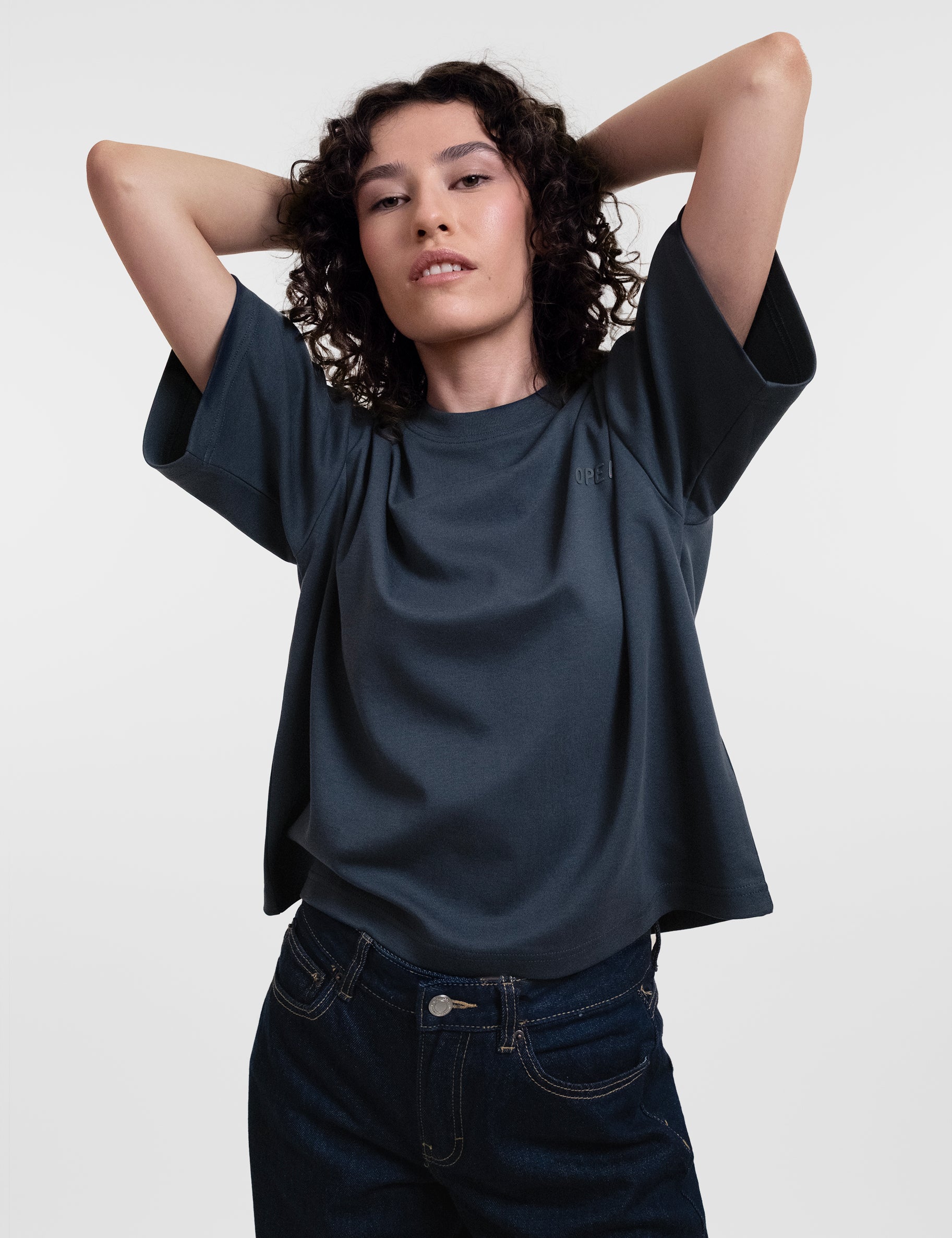 Open Row Women's Open Heart Tee in navy blue, front editorial view.