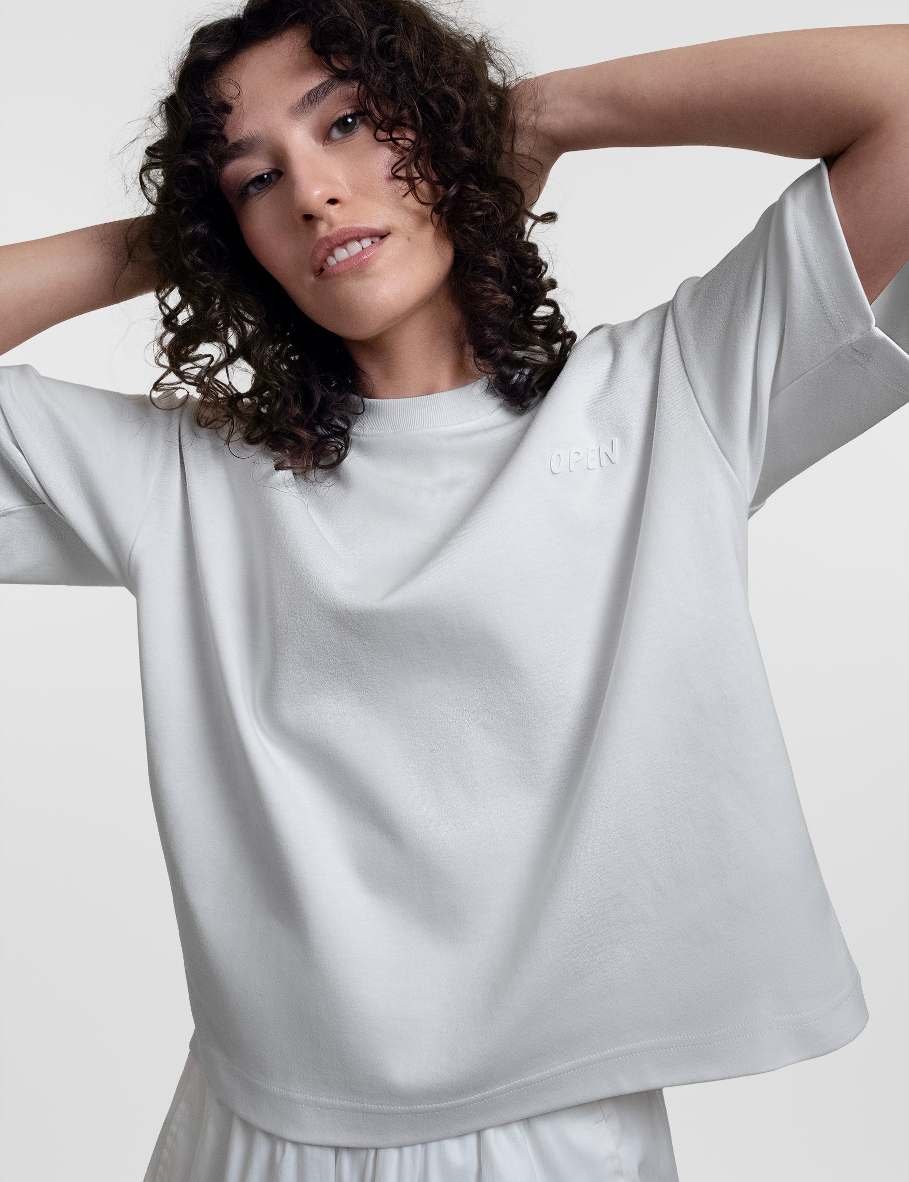 Open Row Women's Open Heart Tee in white, front editorial view.