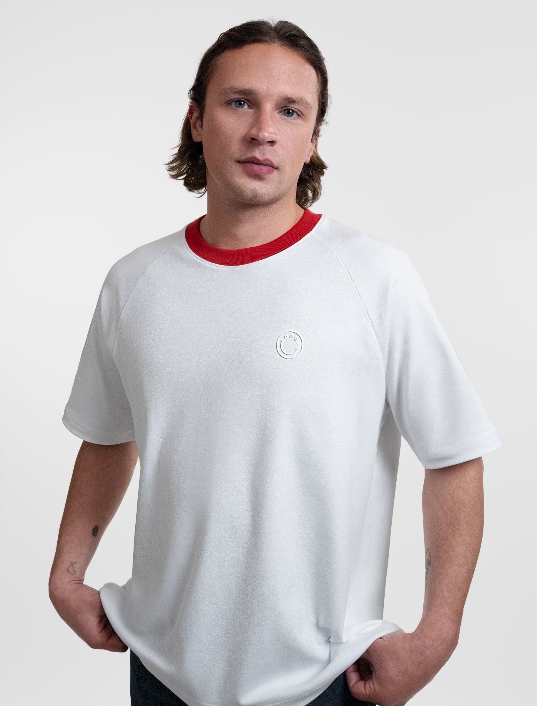 Open Row Men's Runaway Tee in white with red collar, front side view.