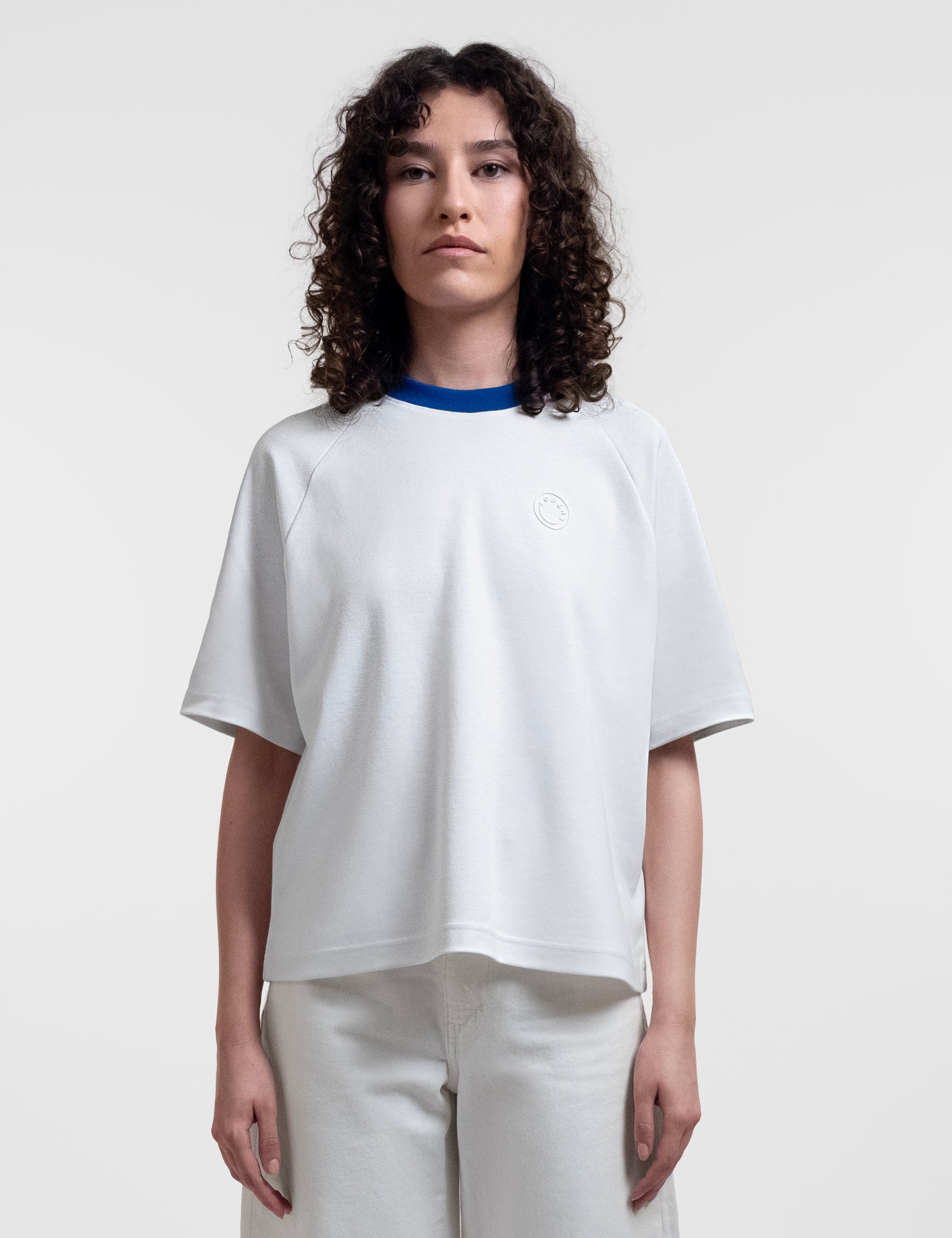 Open Row Women's Runaway Tee in white with blue collar, front view.