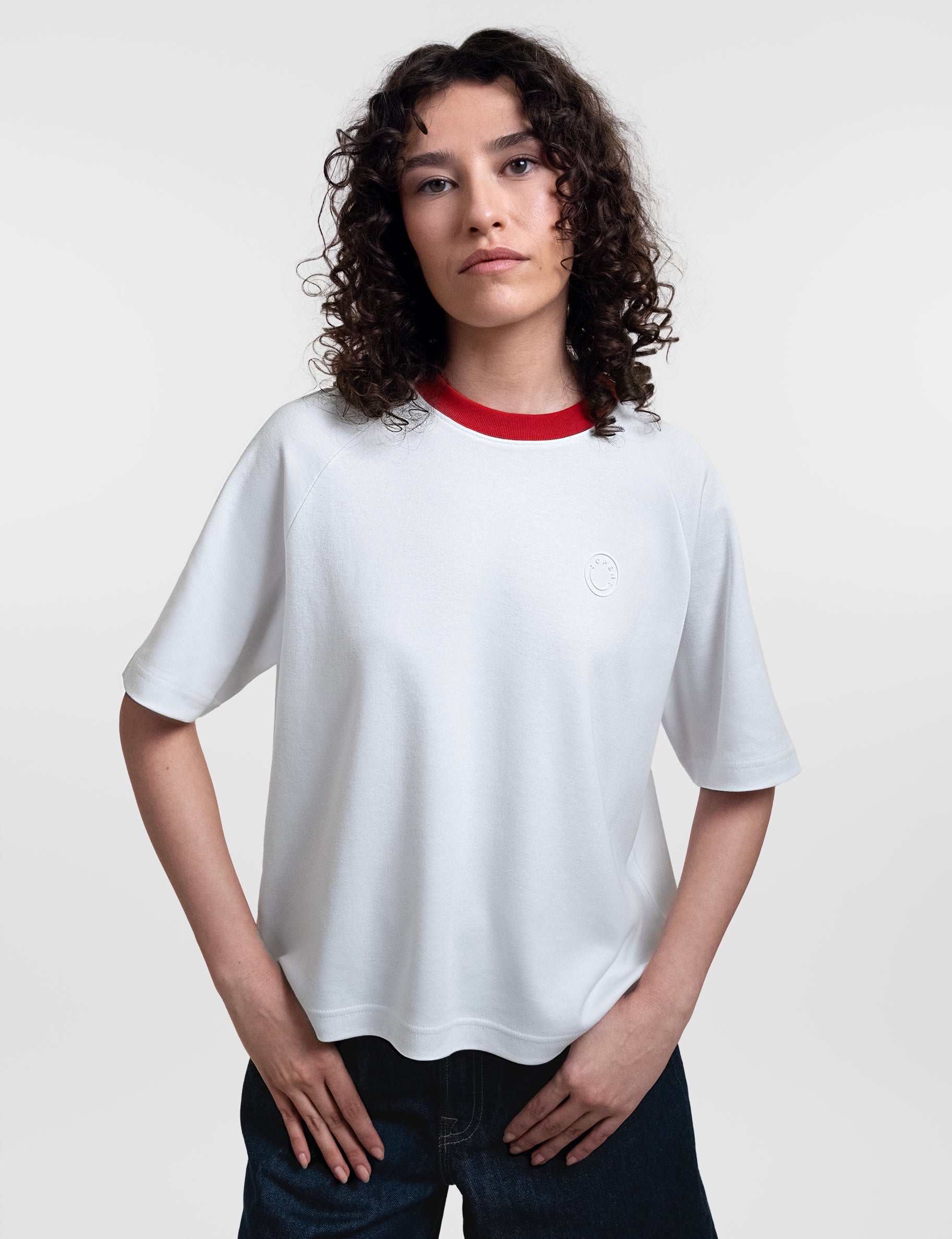 Open Row Women's Runaway Tee in white with red collar, front view.
