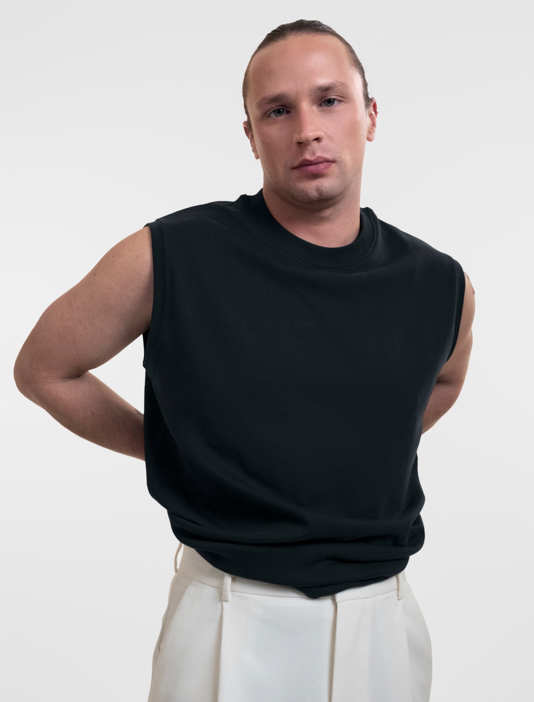 Open Row Men's Tank Tee in black, front view showing waistline.
