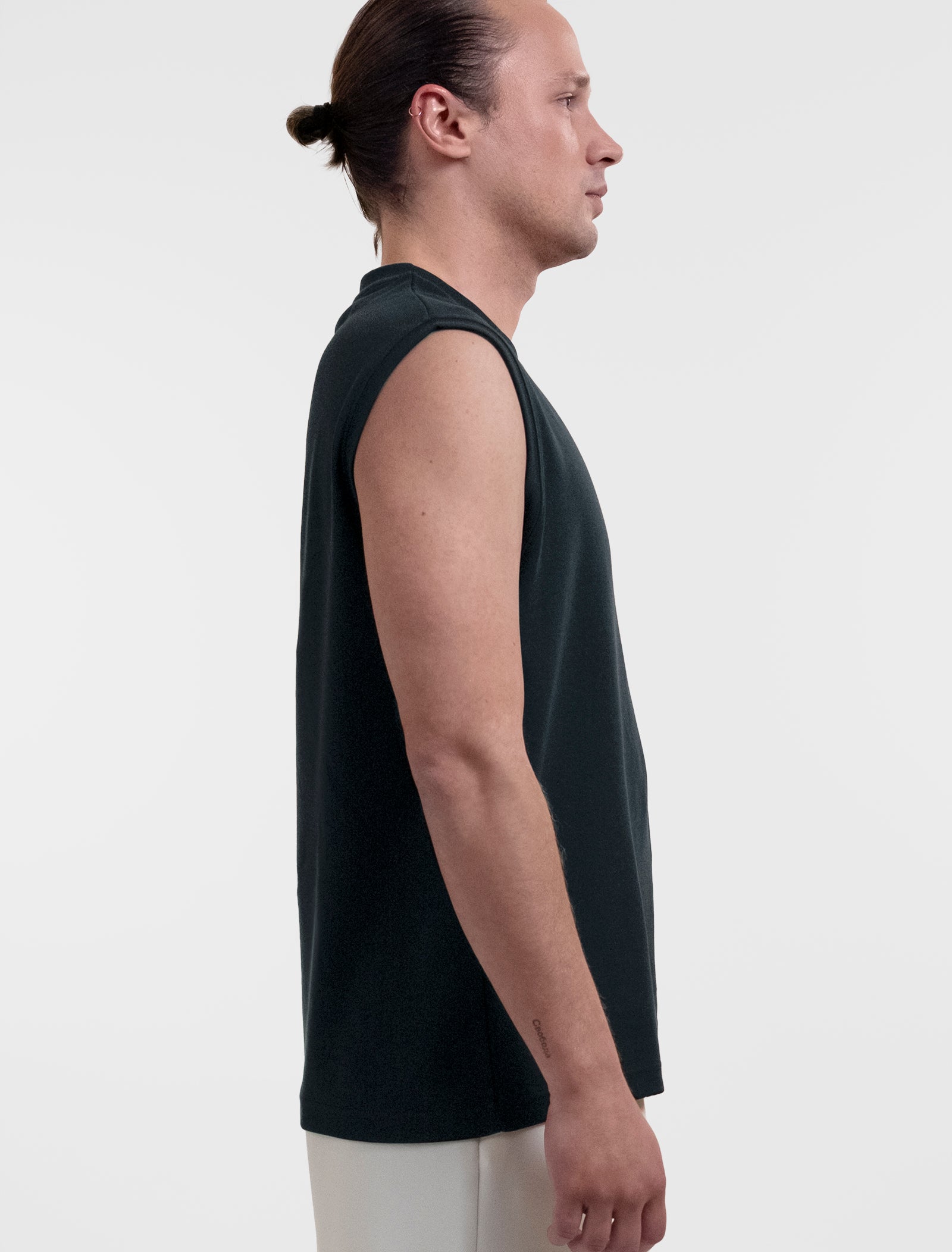Open Row Men's Tank Tee in black, side view.