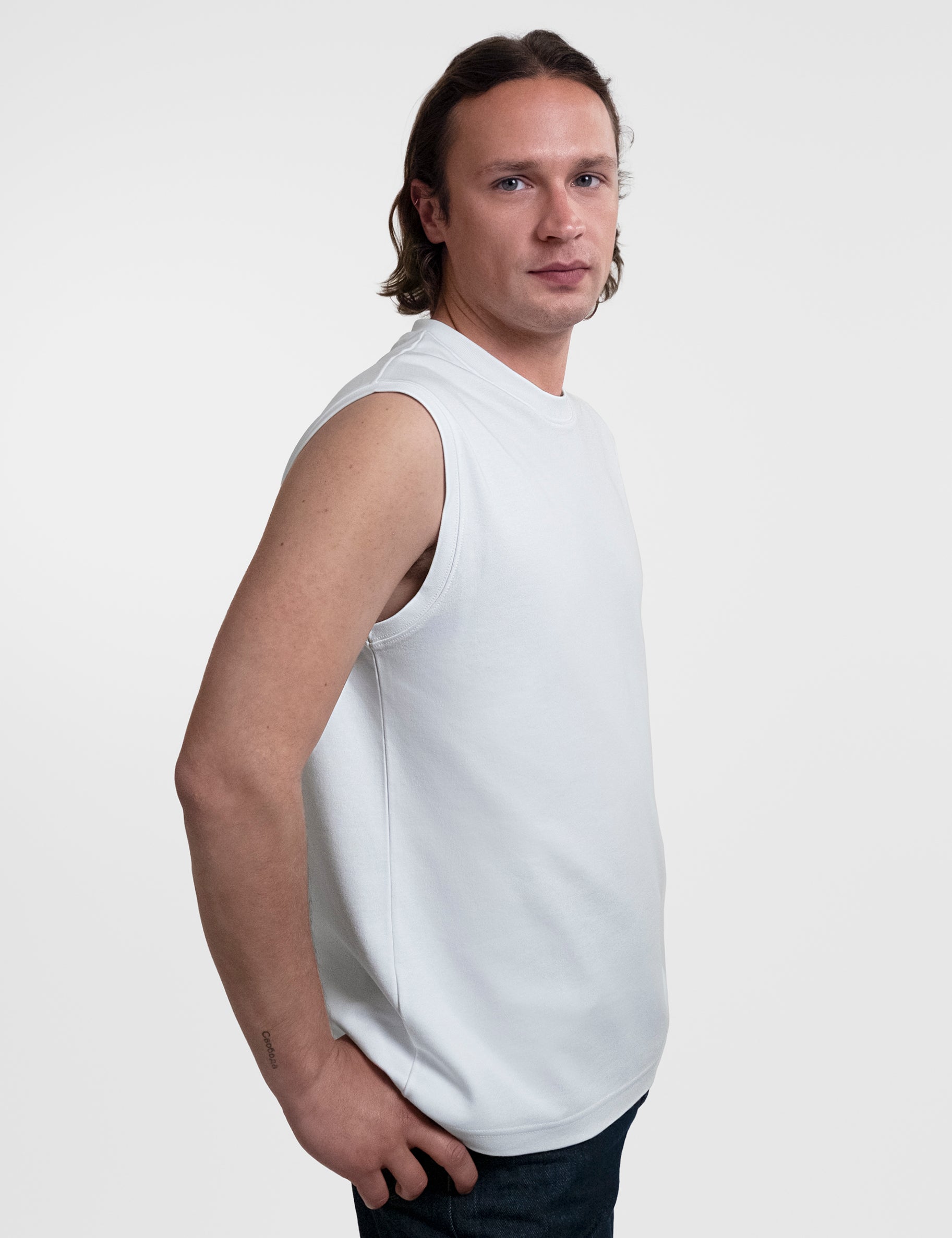 Open Row Men's Tank Tee in white, side view.