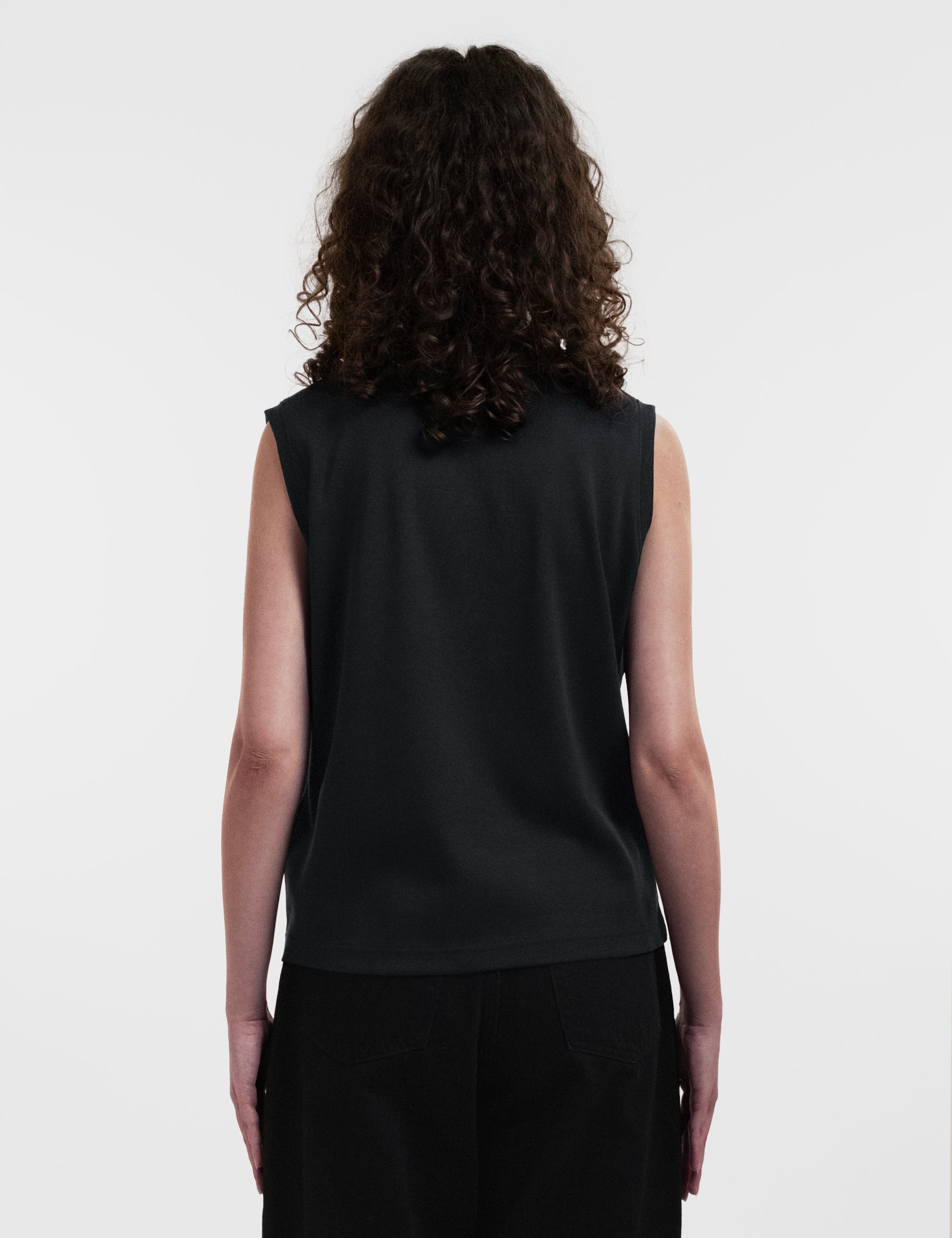 Open Row Women's Tank Tee in black, back view.