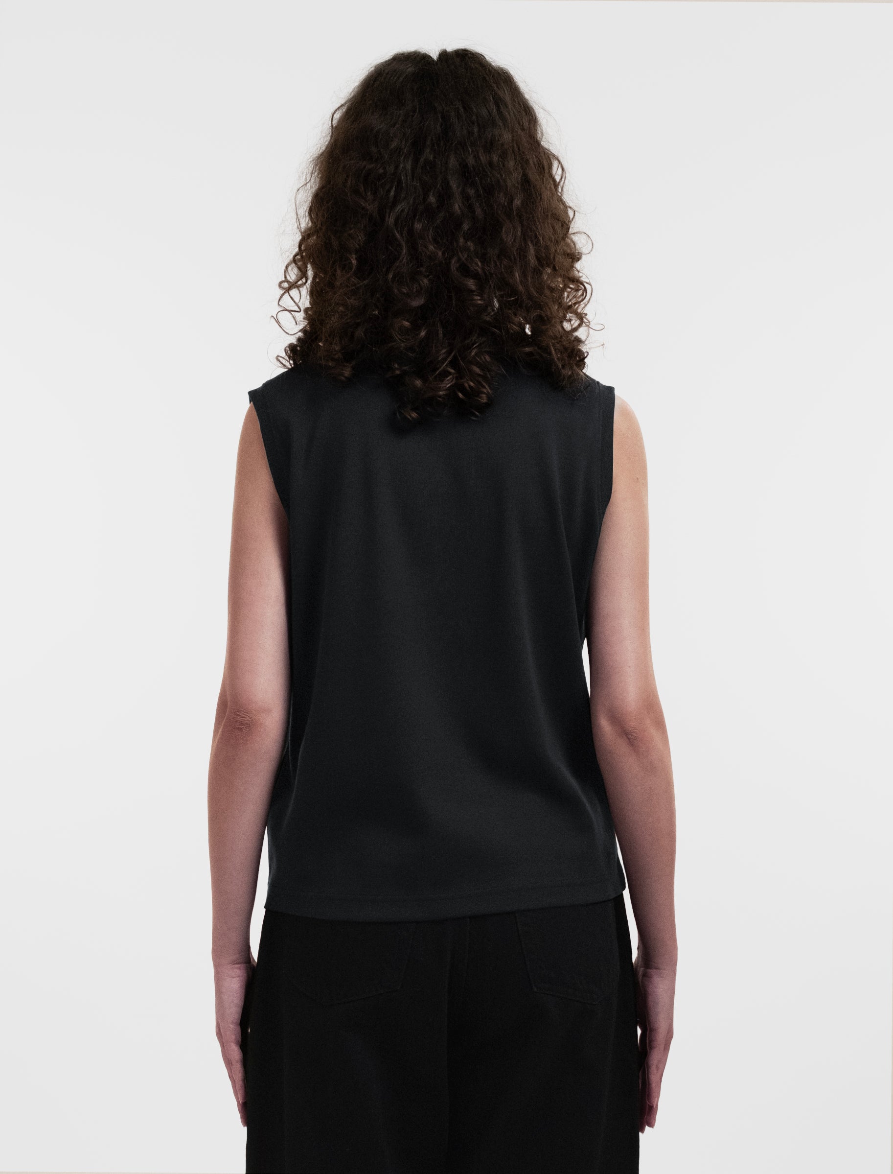 Open Row Women's Tank Tee in black, back view.