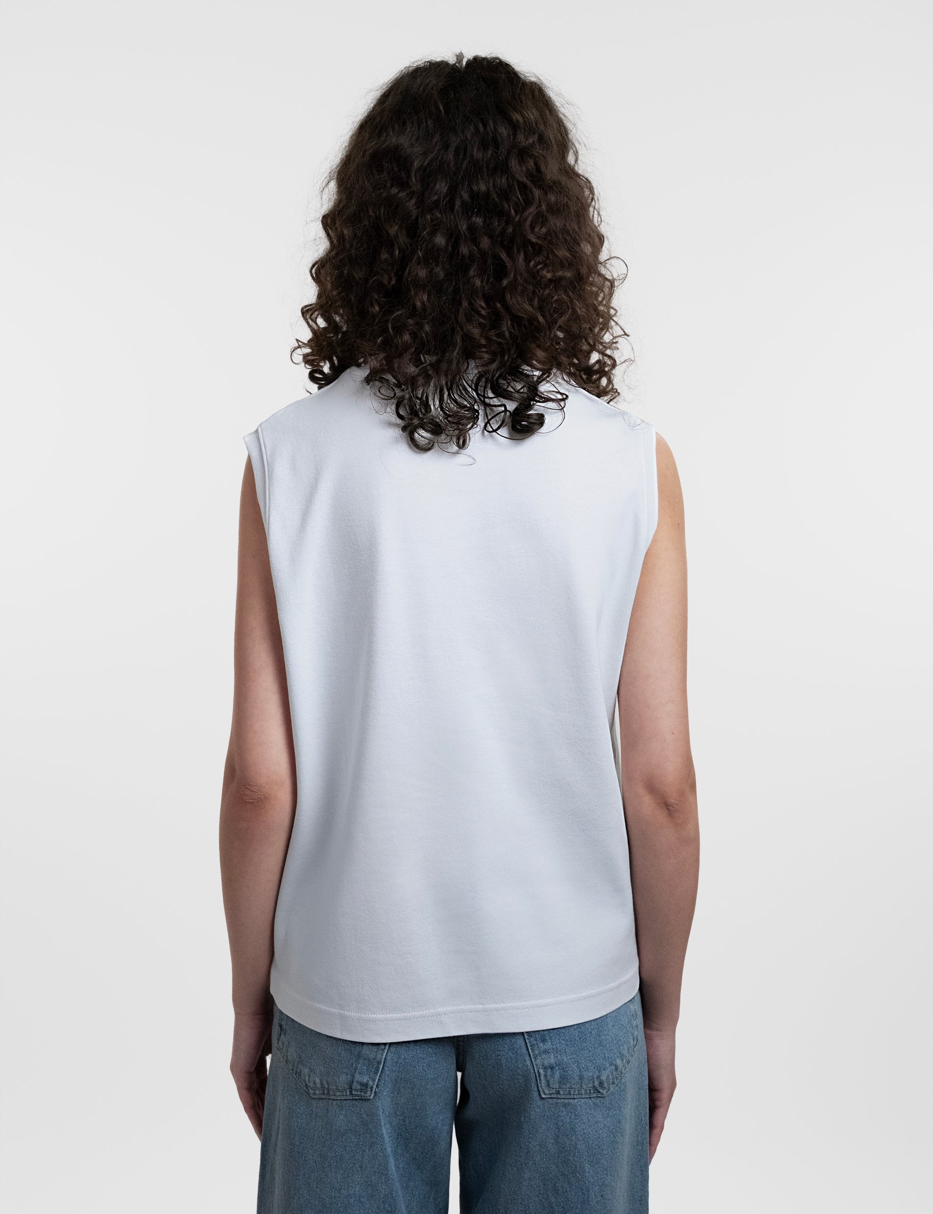 Open Row Women's Tank Tee in white, back view.