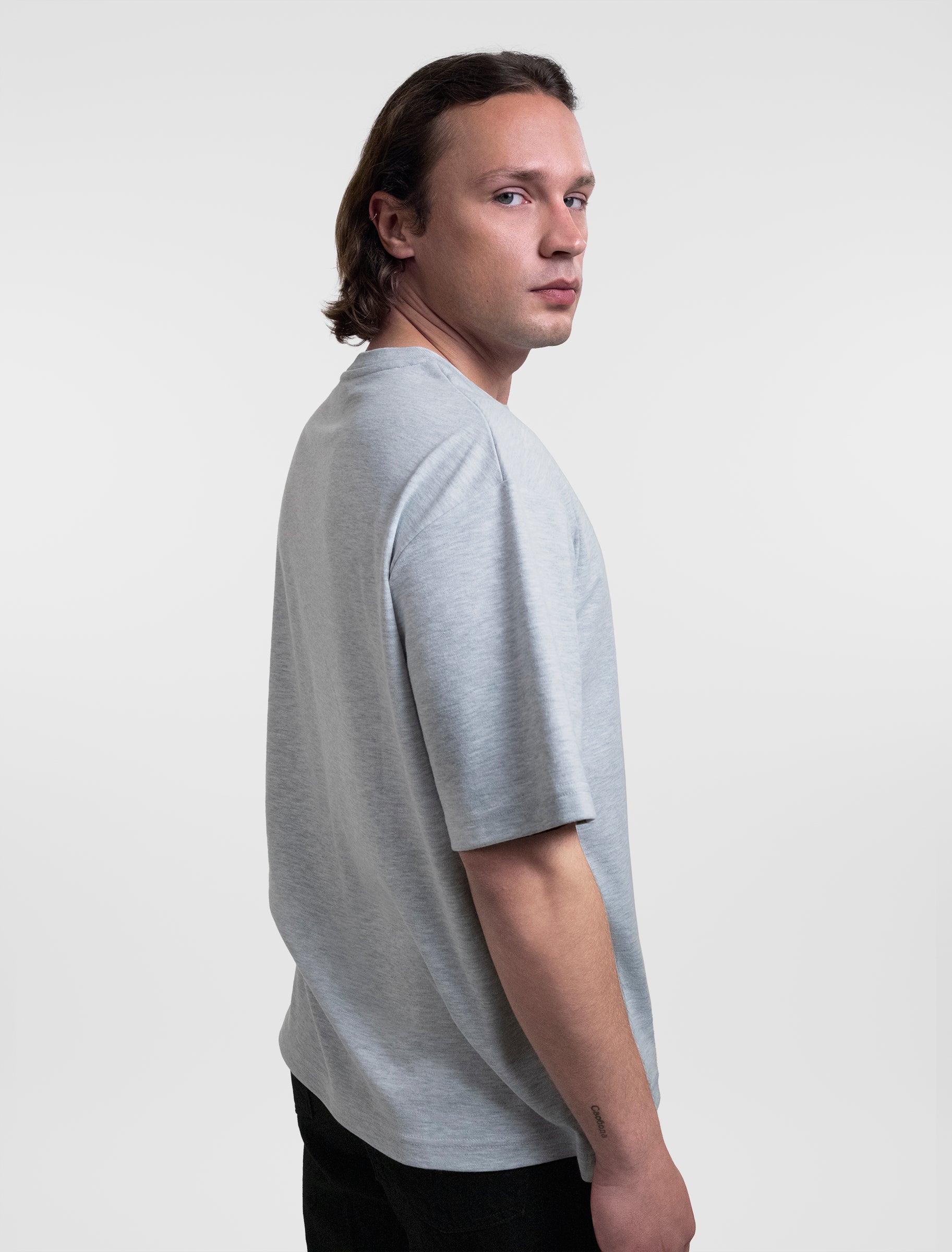 Open Row Men's Open Heart Tee in grey, side view.