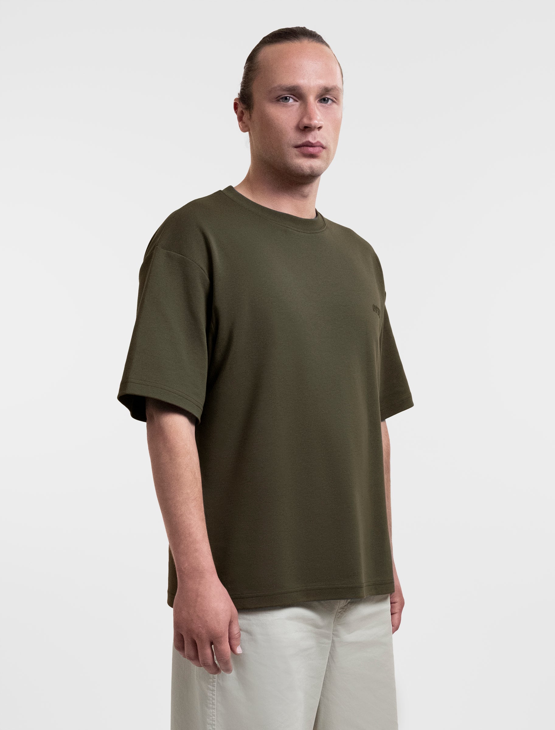 Open Row Men's Open Heart Tee in khaki green, tree-quarter front view.