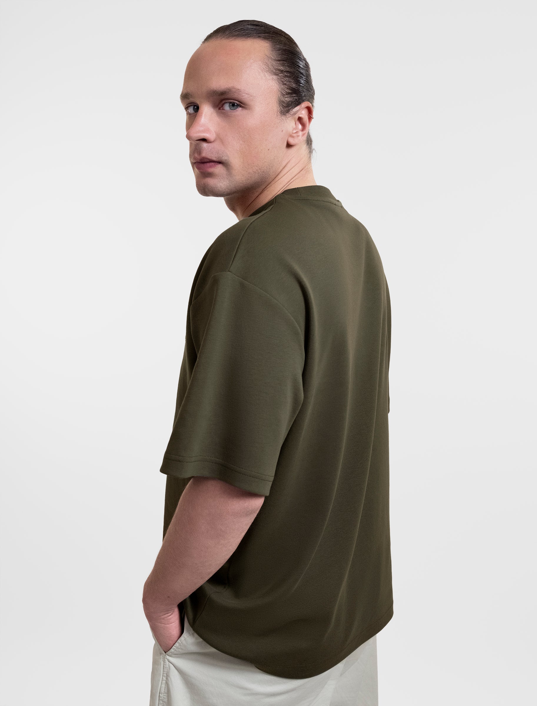 Open Row Men's Open Heart Tee in khaki green, side view.