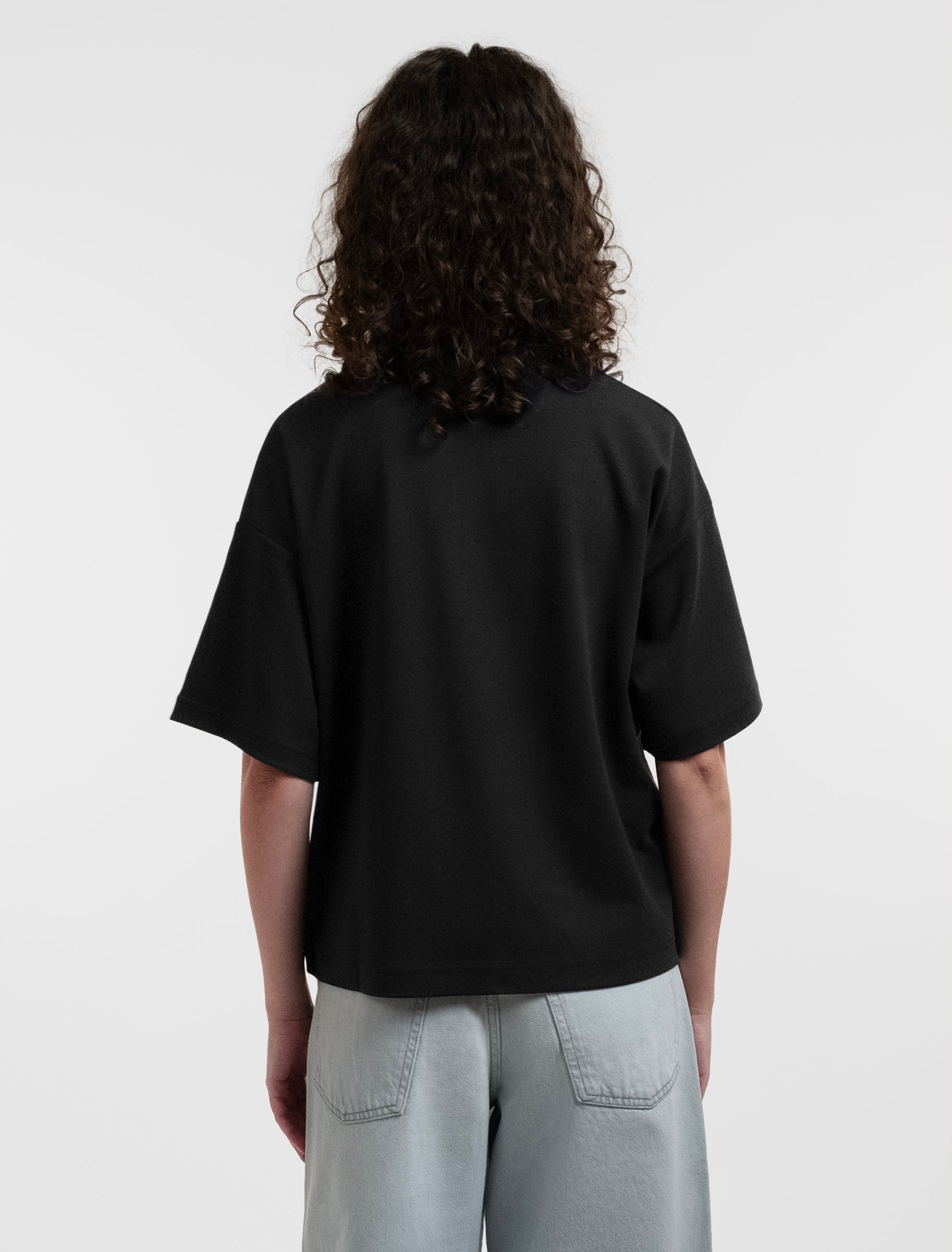 Open Row Women's Open Heart Tee in black, back view.
