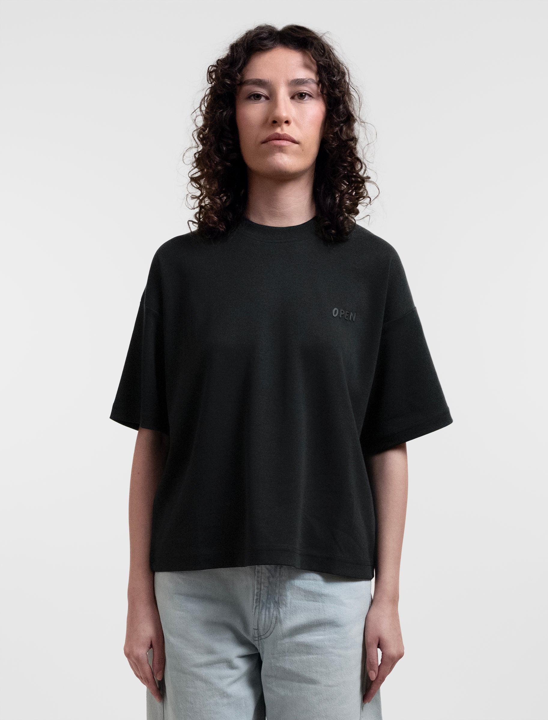 Open Row Women's Open Heart Tee in black, front view.