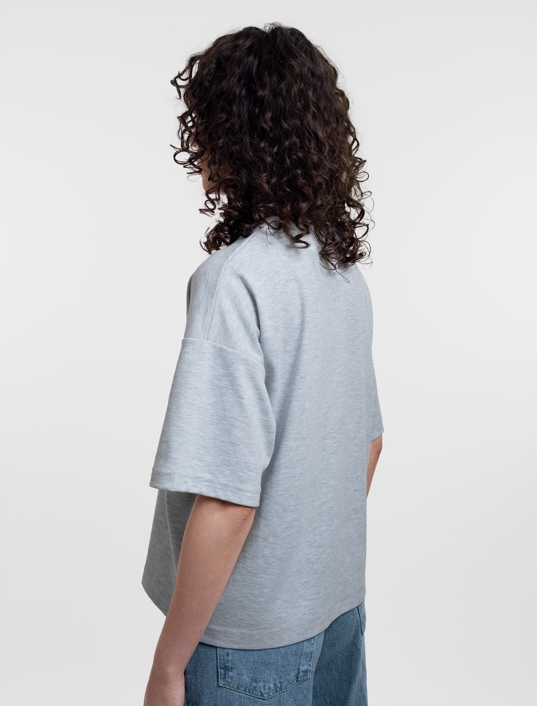 Open Row Women's Open Heart Tee in grey, side view.