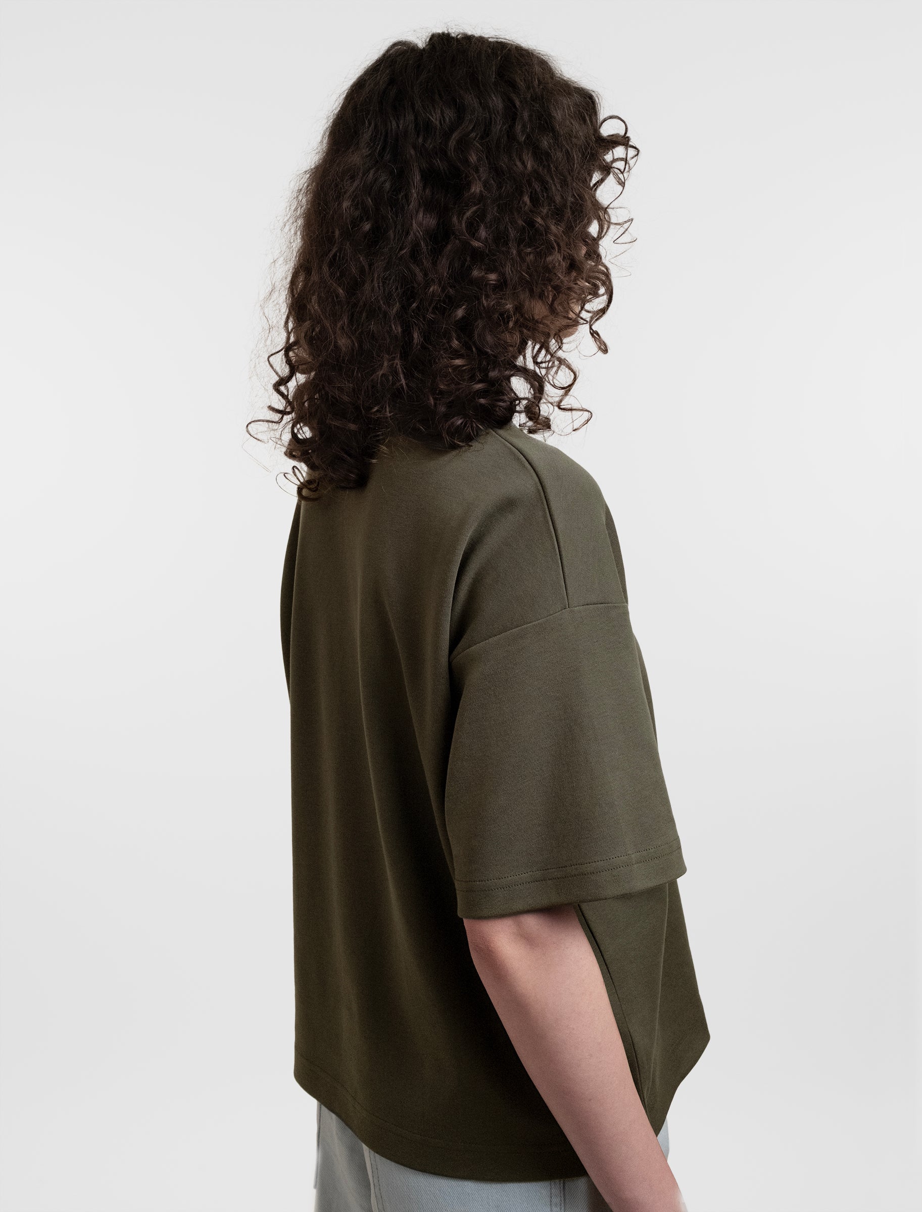 Open Row Women's Open Heart Tee in khaki green, side view.