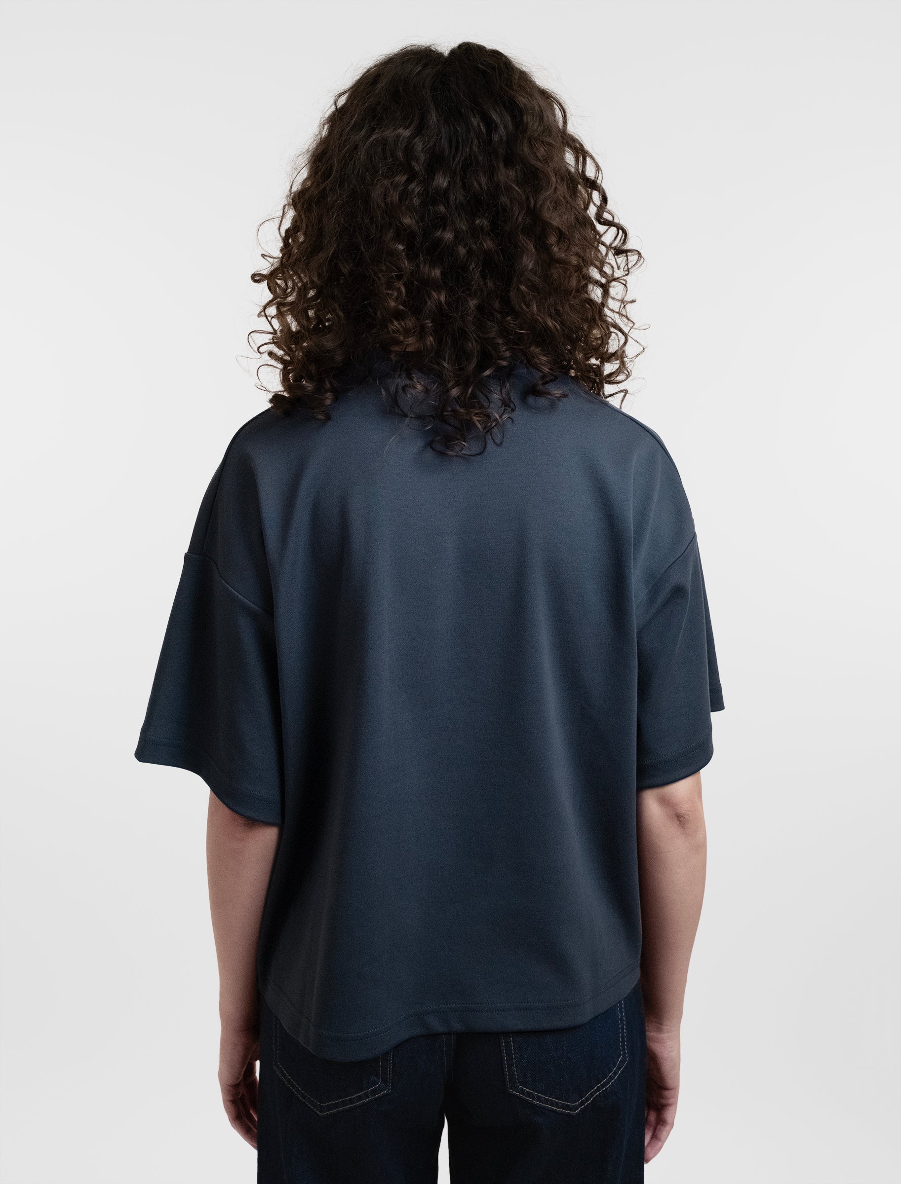 Open Row Women's Open Heart Tee in navy blue, back view.