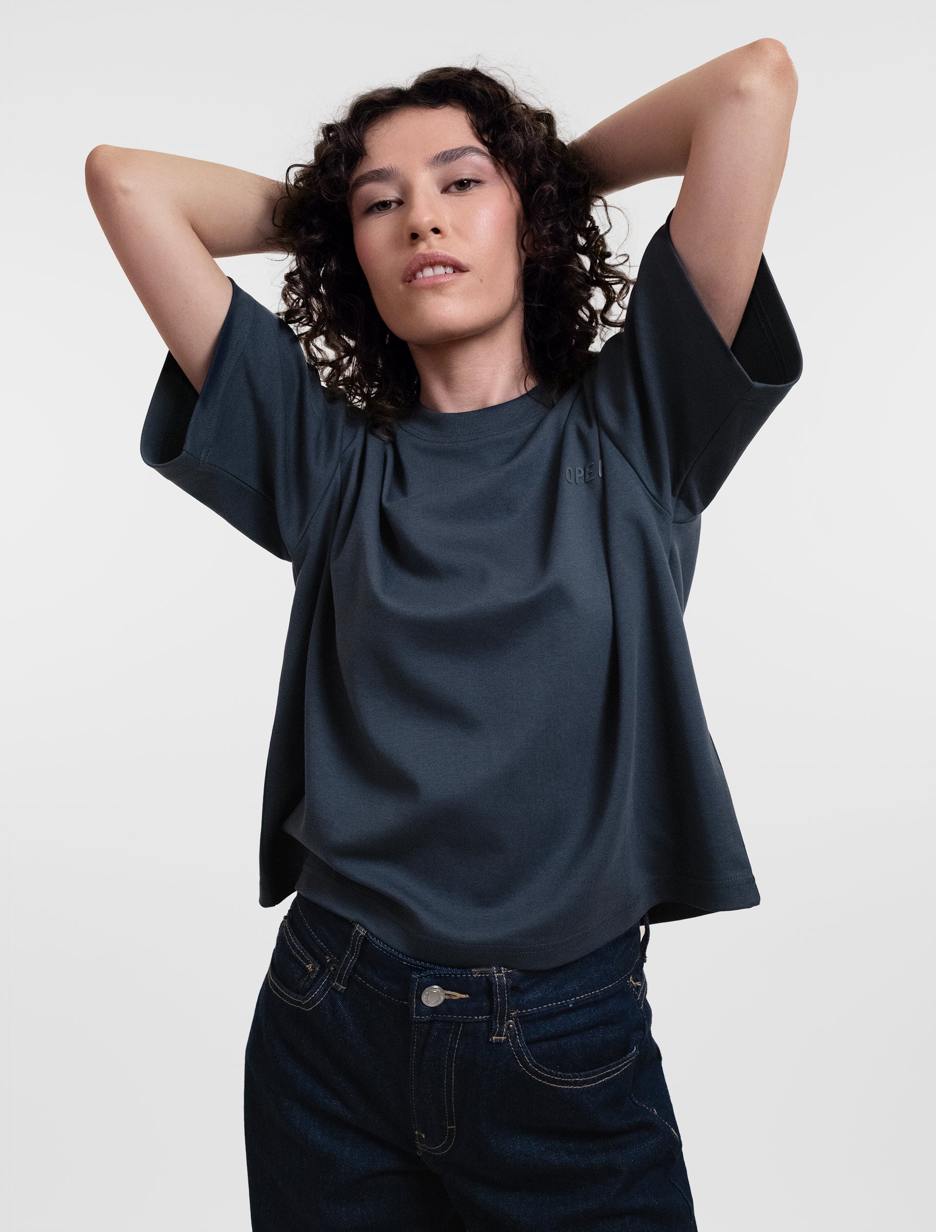 Open Row Women's Open Heart Tee in navy blue, front editorial view.