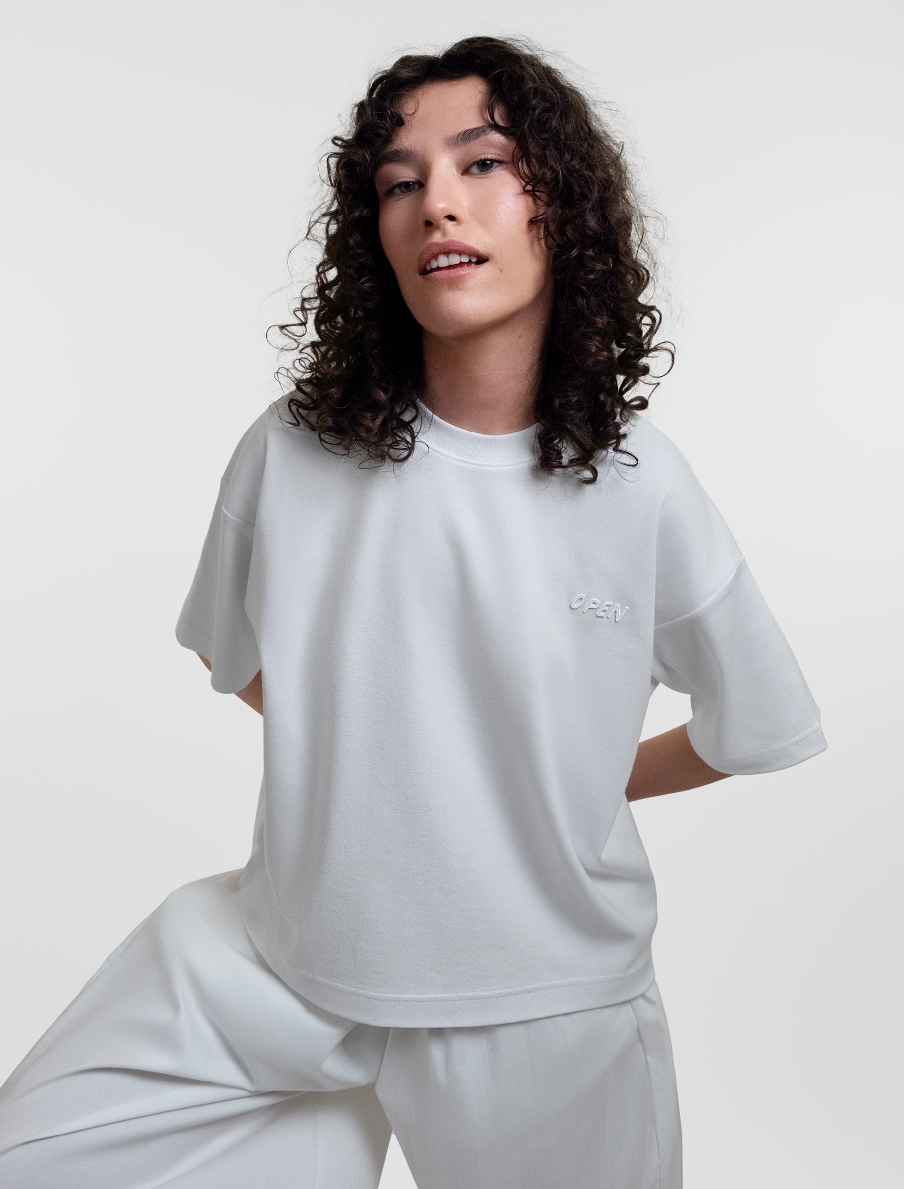 Open Row Women's Open Heart Tee in white, front editorial view.