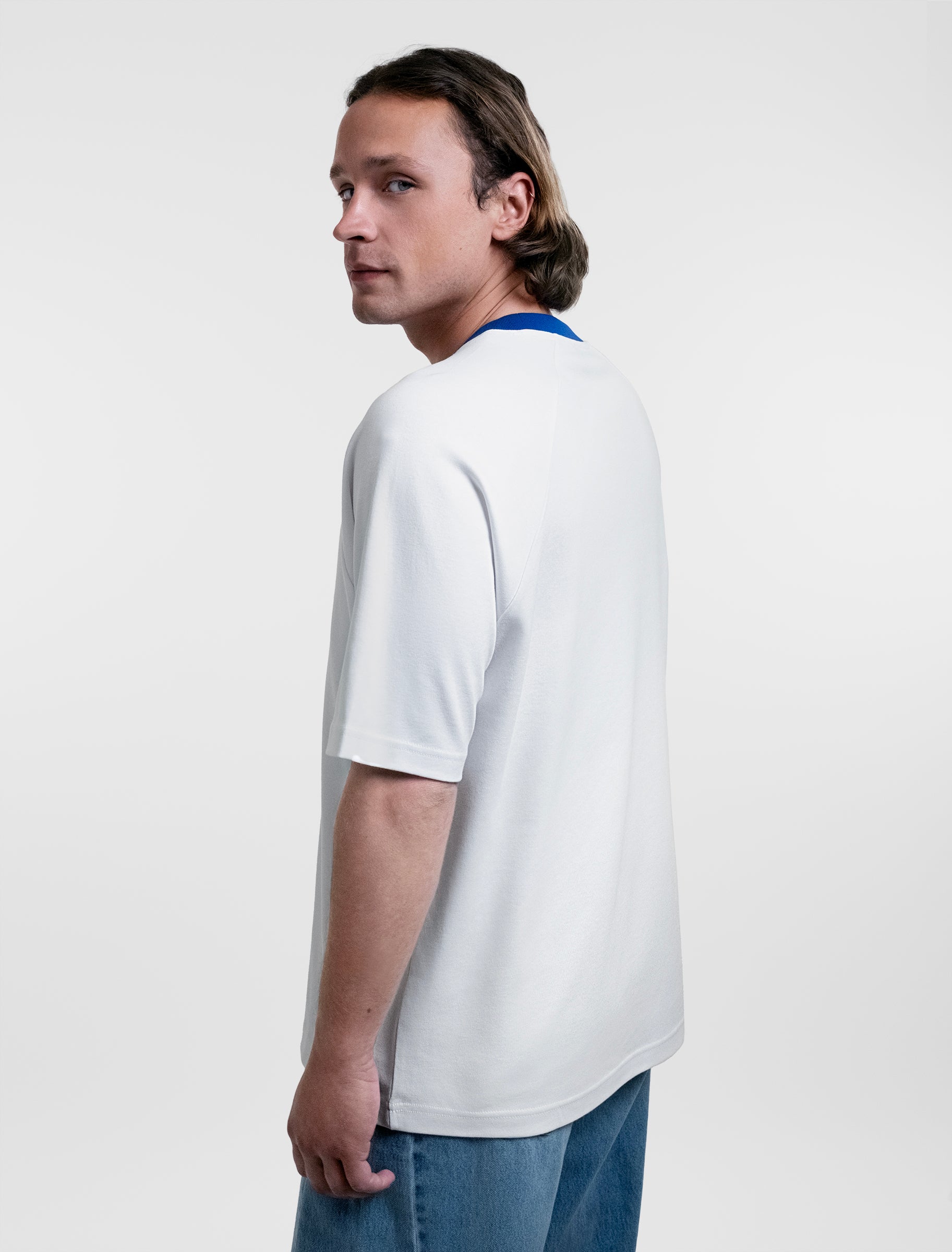 Open Row Men's Runaway Tee in white with blue collar, side view