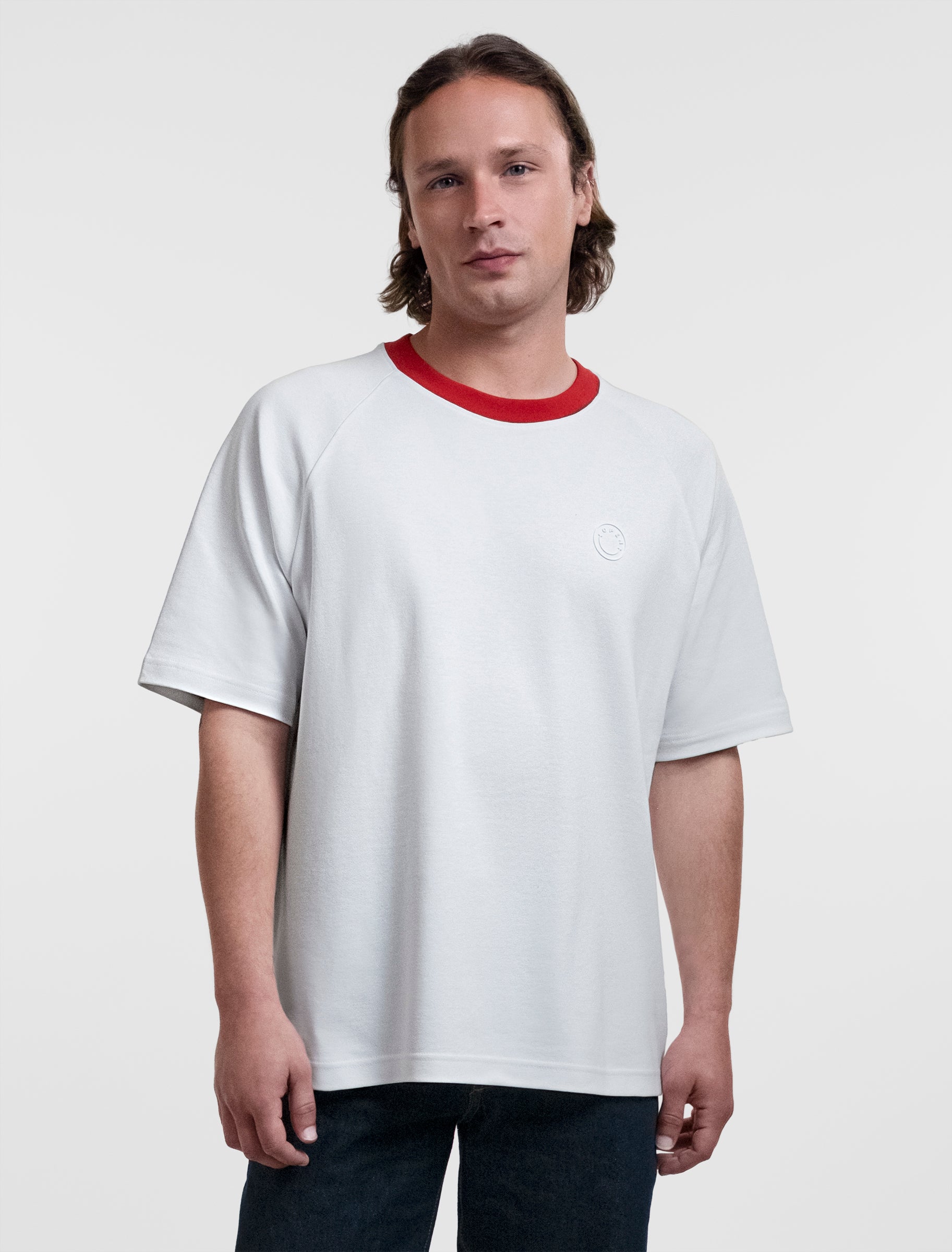 Open Row Men's Runaway Tee in white with red collar, front view.