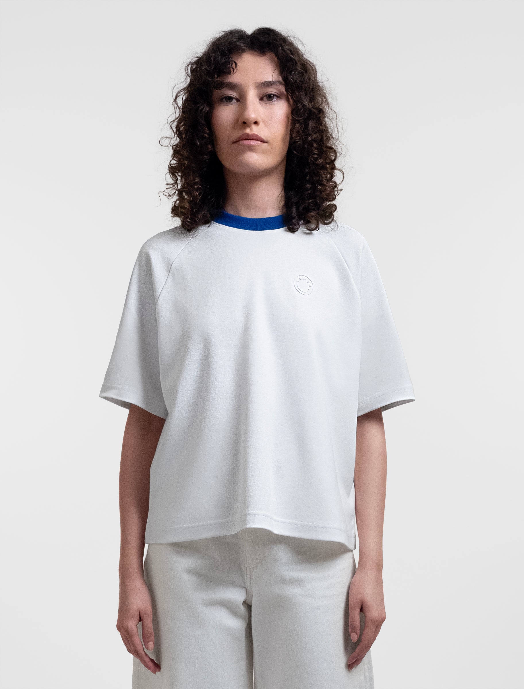 Open Row Women's Runaway Tee in white with blue collar, front view.
