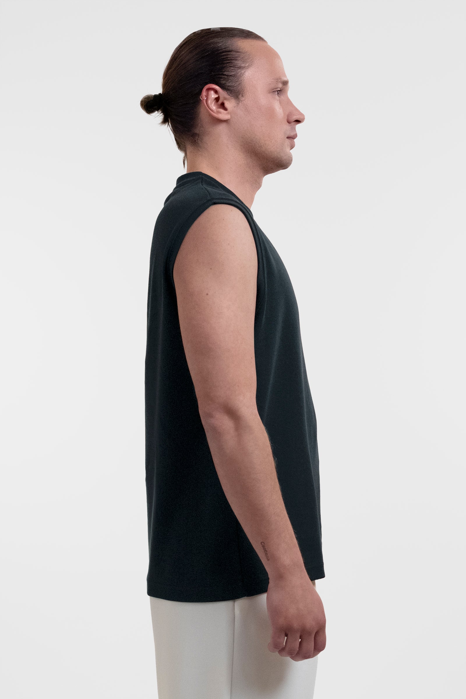 Open Row Men's Tank Tee in black, side view.