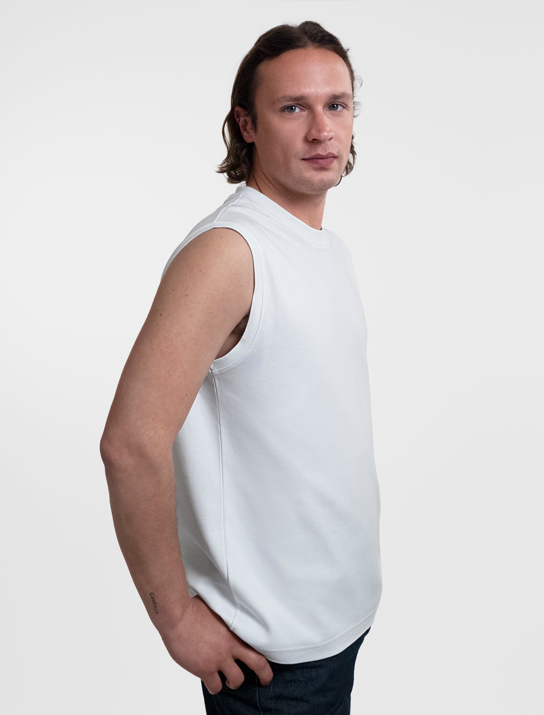 Open Row Men's Tank Tee in white, side view.