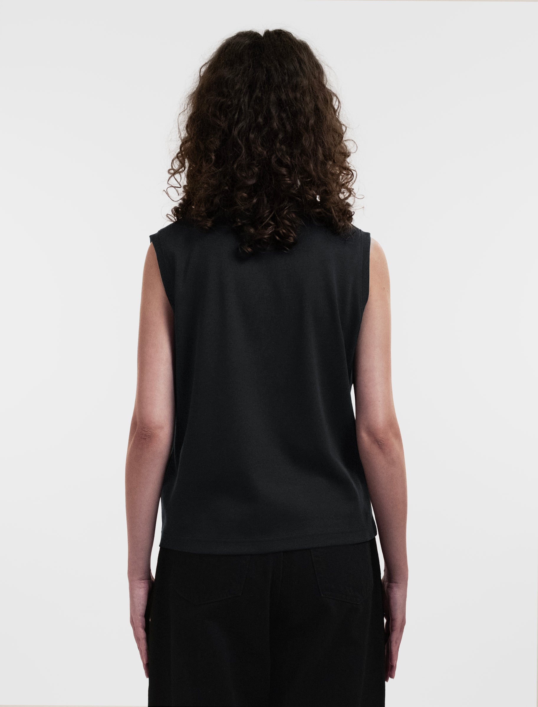 Open Row Women's Tank Tee in black, back view.