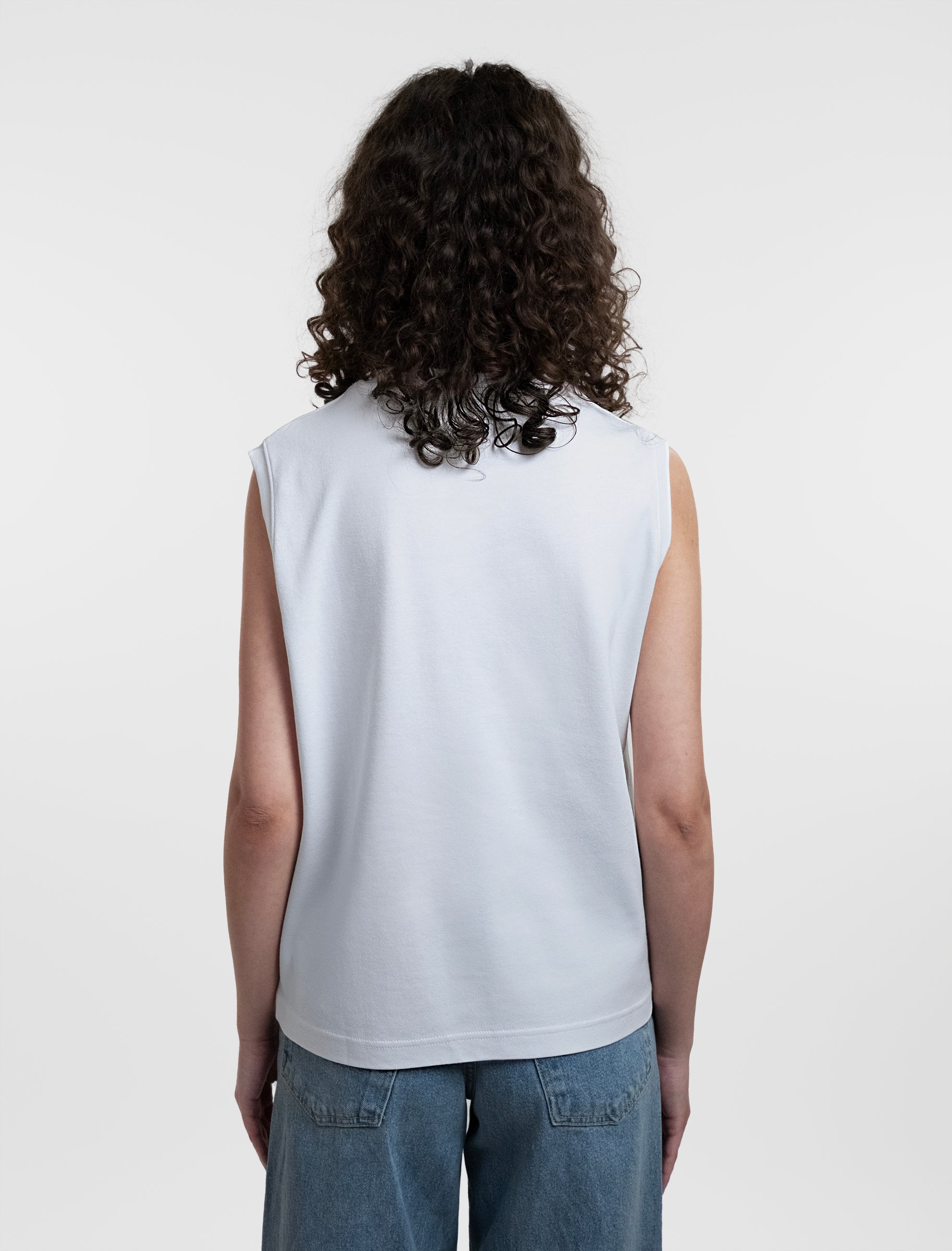 Open Row Women's Tank Tee in white, back view.